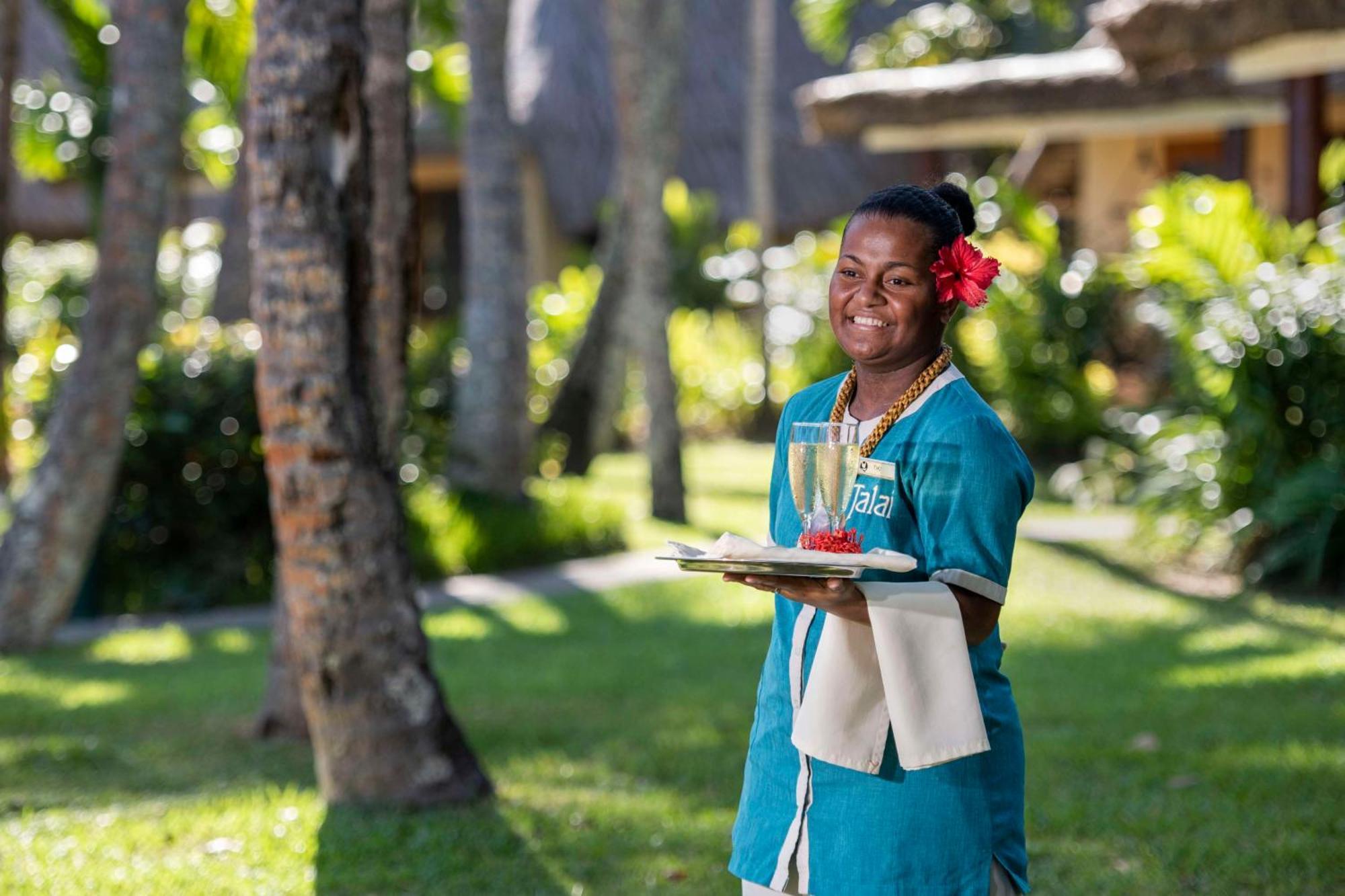 Outrigger Fiji Beach Resort Korotogo Luaran gambar A hotel staff in Mauritius