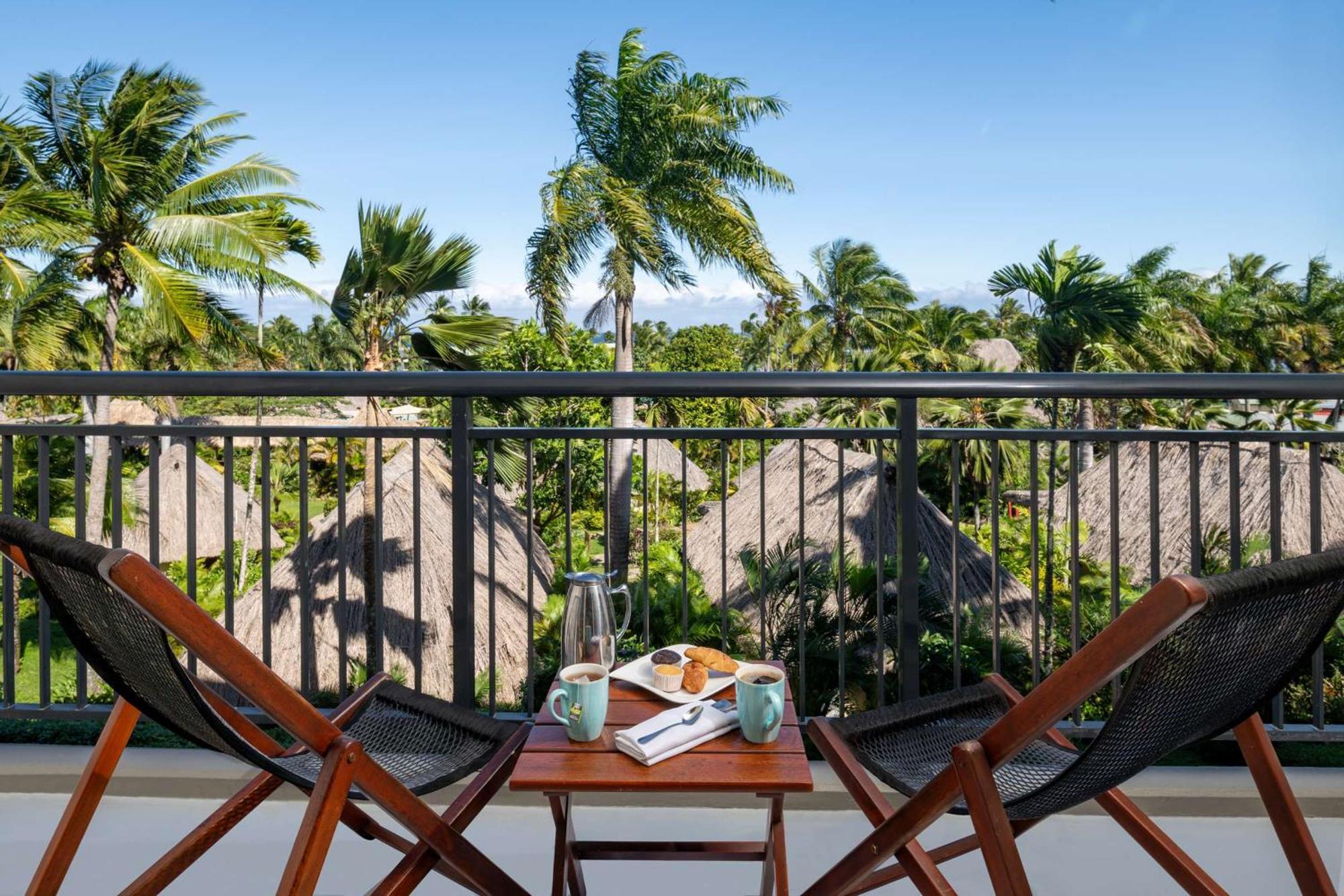Outrigger Fiji Beach Resort Korotogo Luaran gambar A balcony at the resort